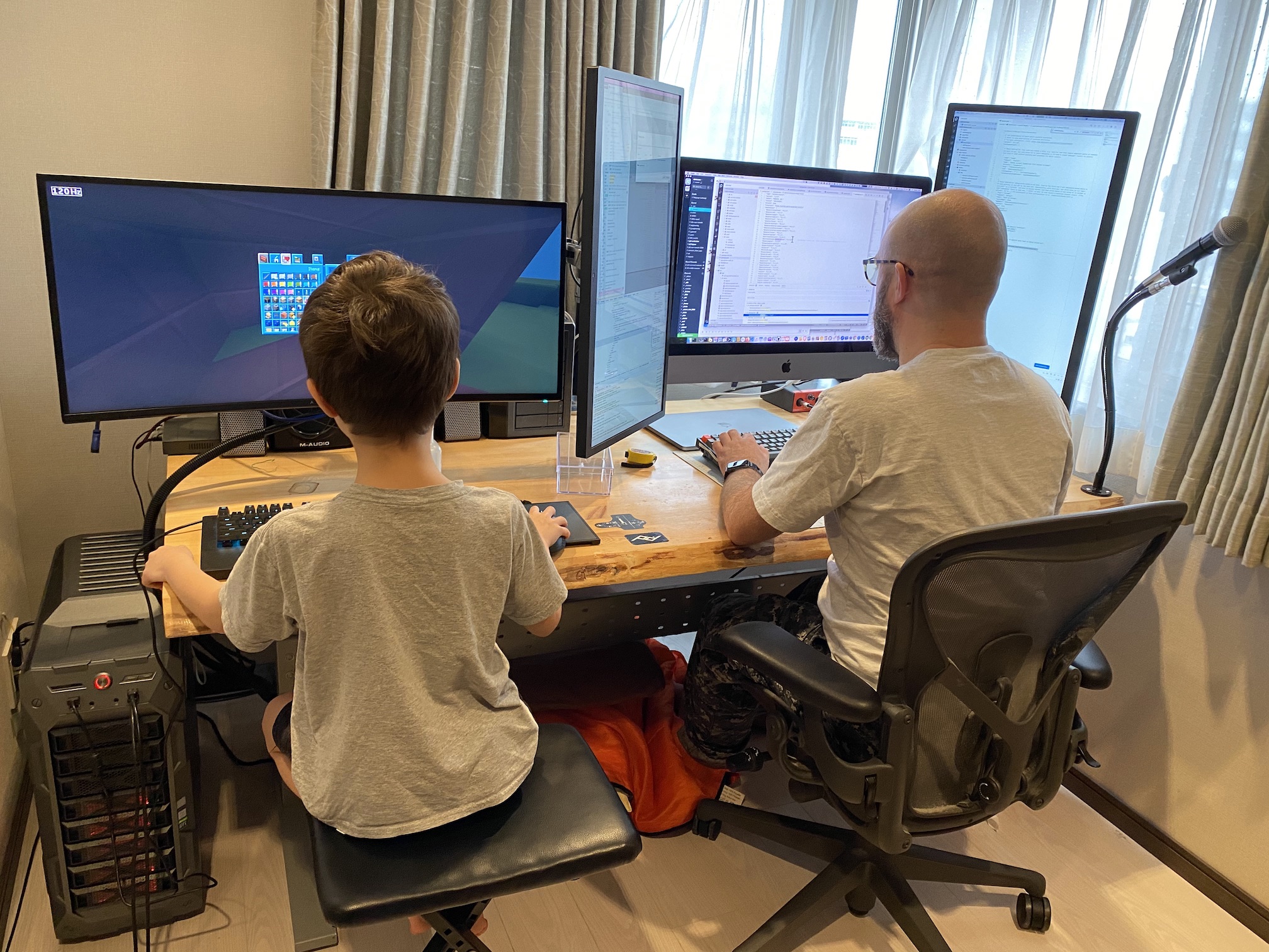 photo of kid and me at desk computing things